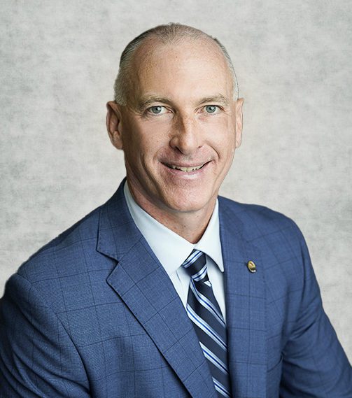 Denis darker Grey Background Denis J. Kelly CHIEF OPERATING OFFICER Sunstates Security