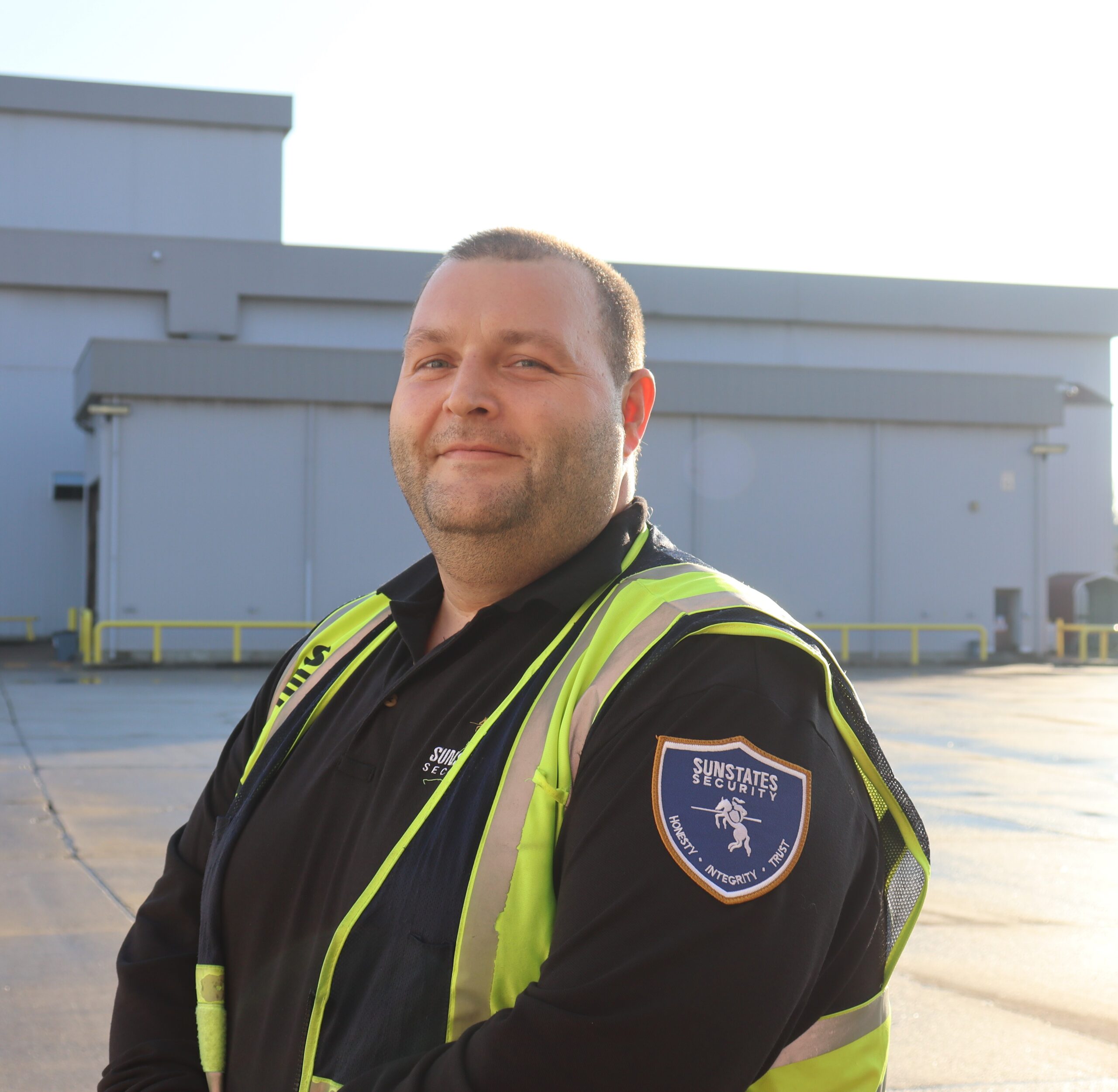 Employee-Engagement-Sunstates-Security-Services security guard outside of a manufacturing facility